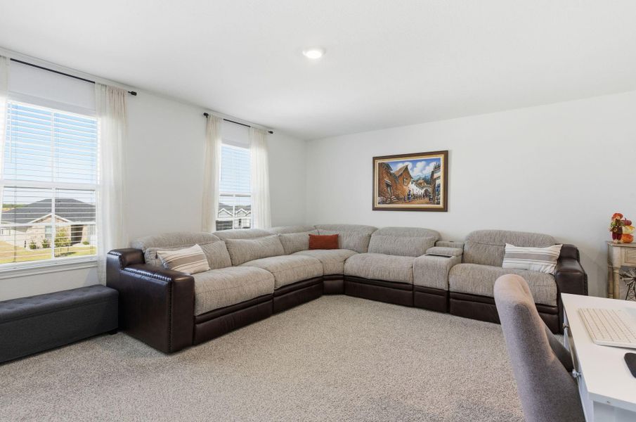 Upstairs game room offering extra space for relaxation or entertainment. Upstairs game room offering extra space for relaxation or entertainment.