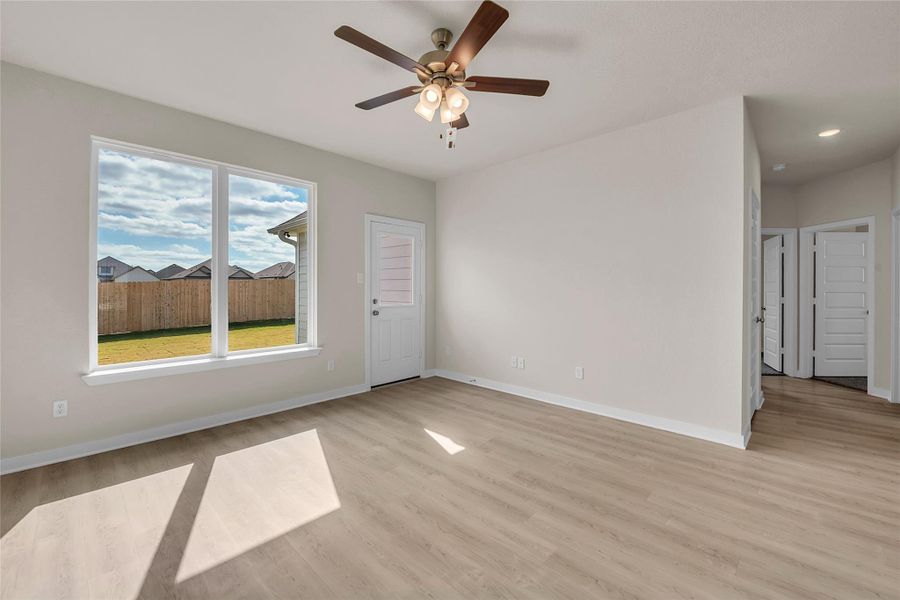 Spare room with light wood-style floors and ceiling fan
