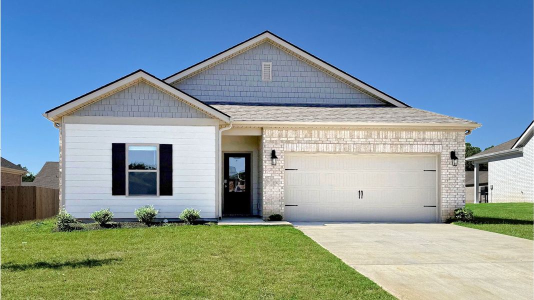 Front exterior of a new home in Riggs Pointe, Millington, TN, highlighting curb appeal (Image 1). Front exterior of a new home in Riggs Pointe, Millington, TN, highlighting curb appeal (Image 1).