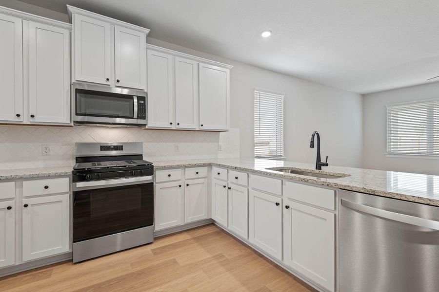 Furnished interior view inside a new home in Emberly, Beasley (Image 9).
