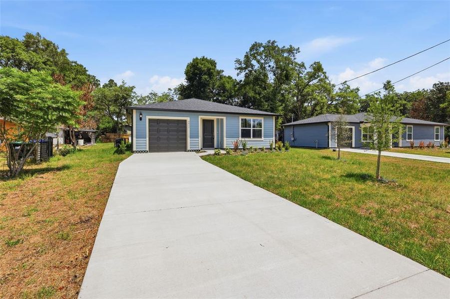 Front exterior of a new home in , Apopka, FL, highlighting curb appeal (Image 19).