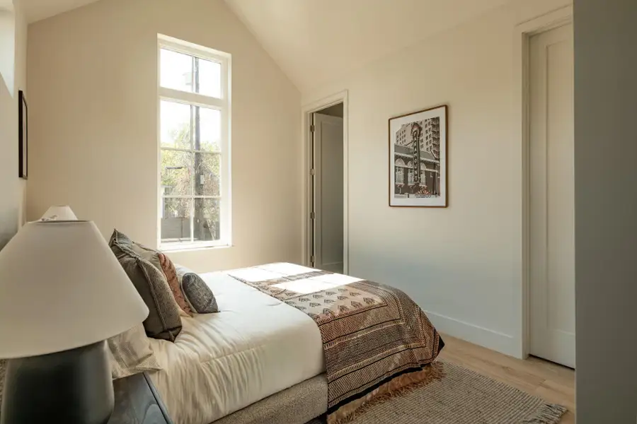 High vaulted ceilings and rich wood floors bring architectural character to this peaceful bedroom. High vaulted ceilings and rich wood floors bring architectural character to this peaceful bedroom.