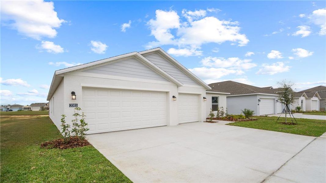 Front exterior of a new home in , Eagle Lake, FL, highlighting curb appeal (Image 20). Front exterior of a new home in , Eagle Lake, FL, highlighting curb appeal (Image 20).