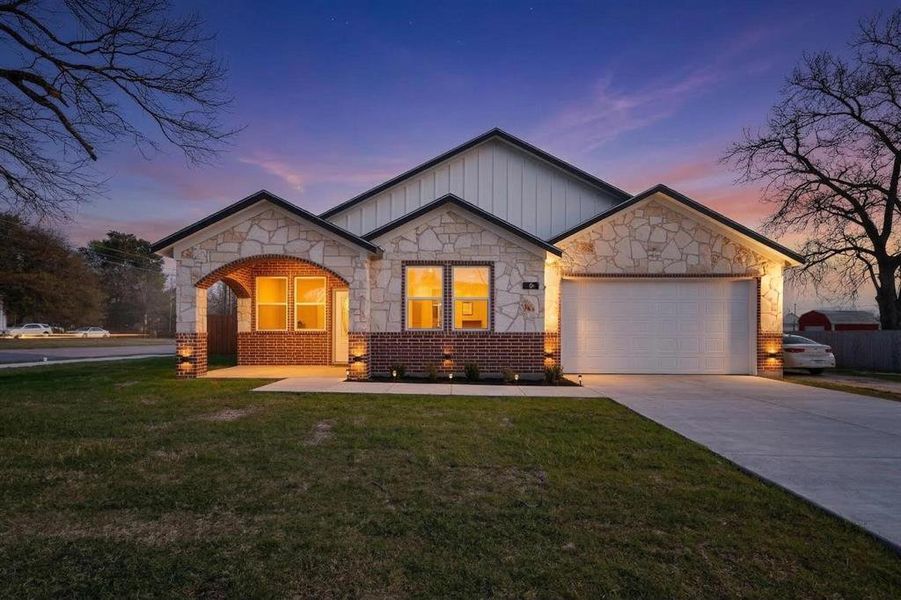 Front exterior of a new home in , Terrell, TX, highlighting curb appeal (Image 2). Front exterior of a new home in , Terrell, TX, highlighting curb appeal (Image 2).