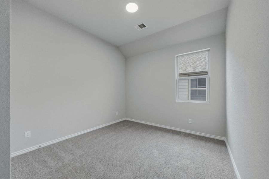 Bedroom in the Cedar home plan by Trophy Signature Homes – REPRESENTATIVE PHOTO