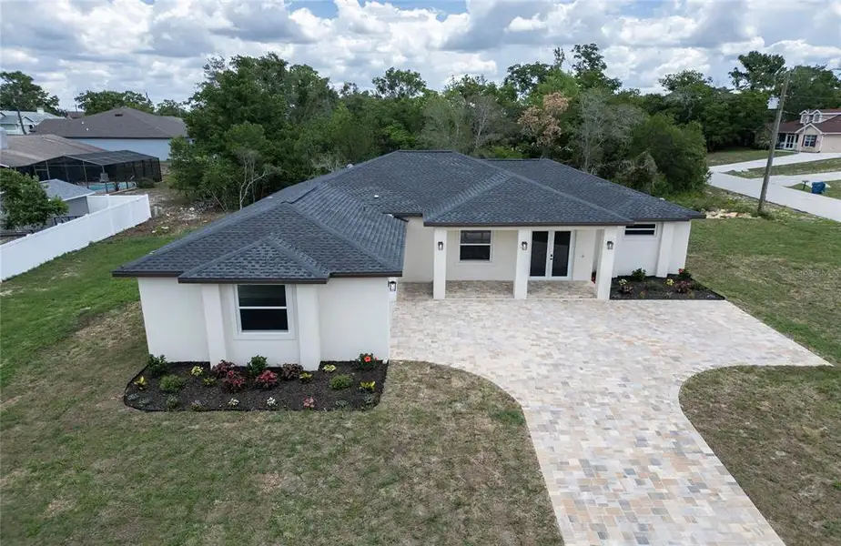 Front exterior of a new home in , Spring Hill, FL, highlighting curb appeal (Image 1). Front exterior of a new home in , Spring Hill, FL, highlighting curb appeal (Image 1).