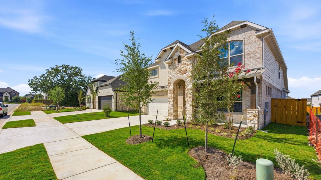 Front exterior of a new home in Oaks at San Gabriel, Georgetown, TX, highlighting curb appeal (Image 22).