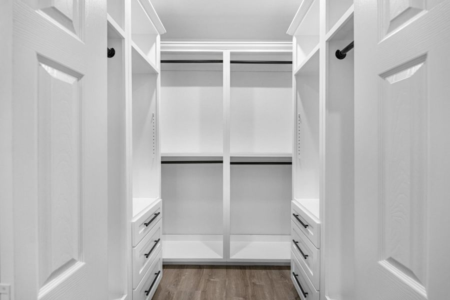 This custom made walk-in closet was made for his and hers in mind. Plenty of storage space and drawers! Such a luxury feel with this closet space!