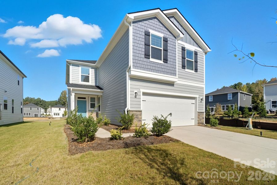 Front exterior of a new home in Bellina, York, SC, highlighting curb appeal (Image 21).
