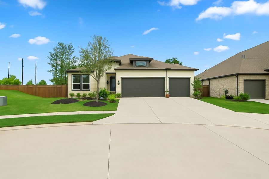 7403 Hanover Ln offers an oversized garage with a 3rd car bay! The exterior can be converted to give additional entry! *This photo has been virtually edited to show the third car garage door and additional driveway space 7403 Hanover Ln offers an oversized garage with a 3rd car bay! The exterior can be converted to give additional entry! *This photo has been virtually edited to show the third car garage door and additional driveway space