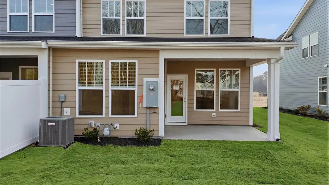 Accomplished exterior with a spacious rear porch that blends comfort and style