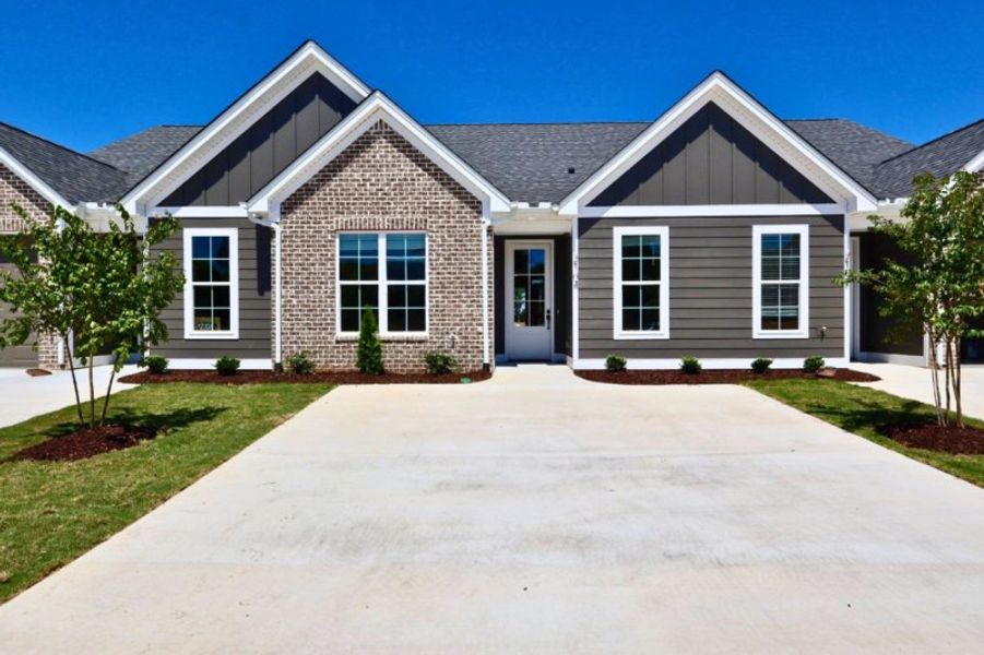 Front exterior of a new home in The Hoback, Cleveland, TN, highlighting curb appeal (Image 19). Front exterior of a new home in The Hoback, Cleveland, TN, highlighting curb appeal (Image 19).