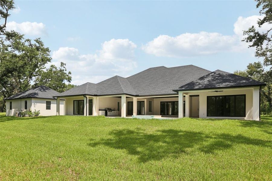 Front exterior of a new home in , Lutz, FL, highlighting curb appeal (Image 25).