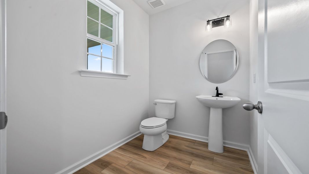 Convenient half bath tucked on the main level