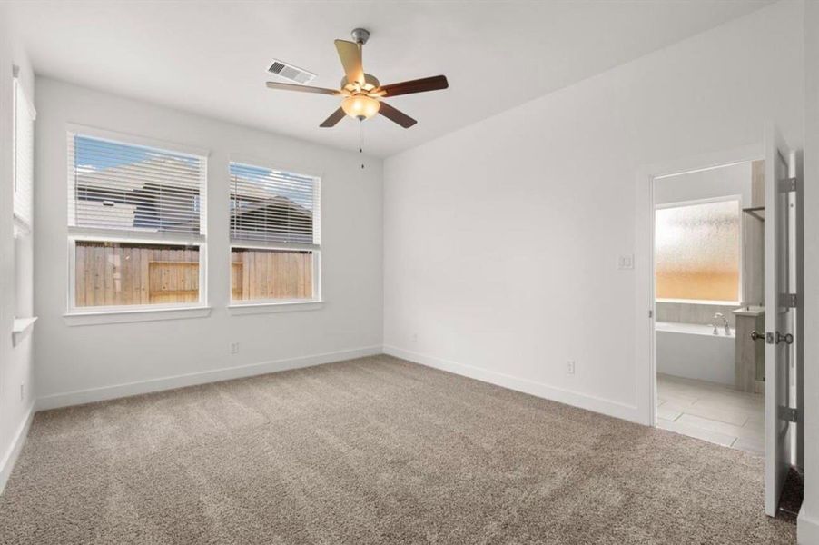 Spacious, unfurnished interior of a new home in Sunterra, Katy (Image 11).