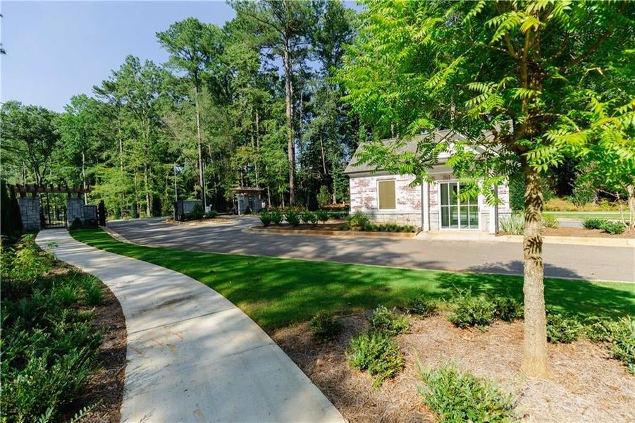 You are greeted with lush green landscaping upon your arrival.