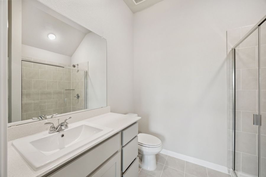 Primary Bathroom in the Pine home plan by Trophy Signature Homes - REPRESENTATIVE PHOTO