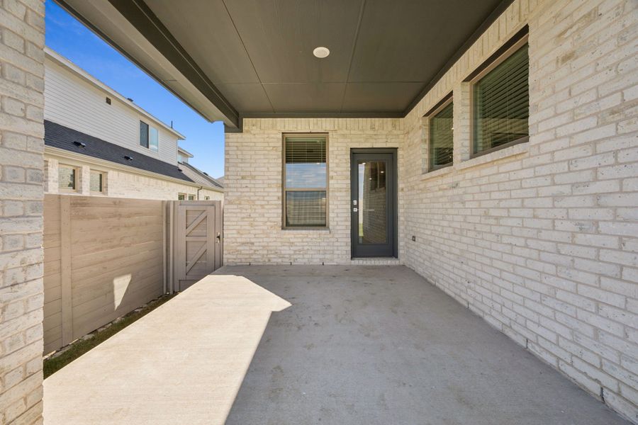 Covered Patio in the Wimbledon home plan by Trophy Signature Homes – REPRESENTATIVE PHOTO