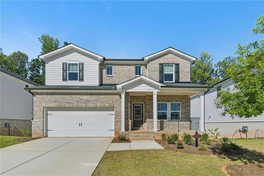 Front exterior of a new home in Martin Springs - Estate Series, Lawrenceville, GA, highlighting curb appeal (Image 24). Front exterior of a new home in Martin Springs - Estate Series, Lawrenceville, GA, highlighting curb appeal (Image 24).