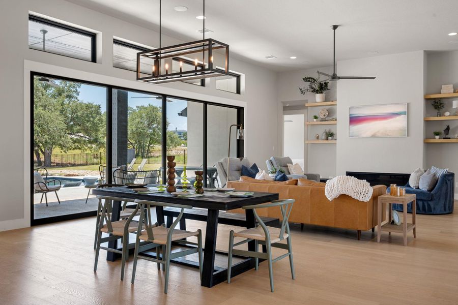 Massive sliding glass doors open the spacious main living areas to the outdoors.