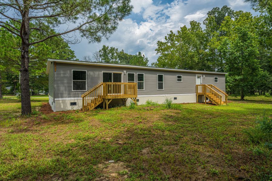 Exterior details and patio area of a home in , Cottageville (Image 25).