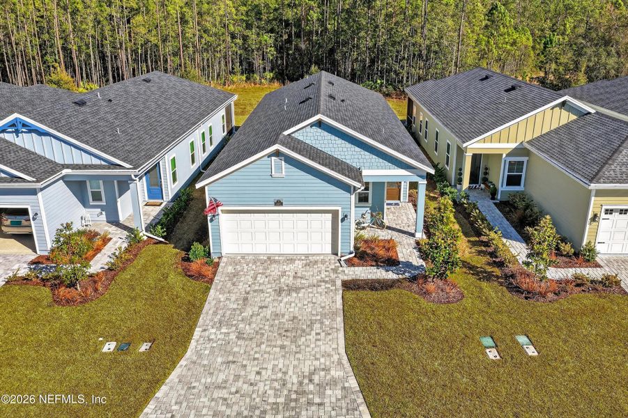 Front exterior of a new home in , St. Johns, FL, highlighting curb appeal (Image 24). Front exterior of a new home in , St. Johns, FL, highlighting curb appeal (Image 24).