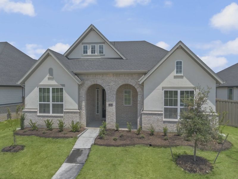 Representative exterior photo of a completed home built from the Mickelson by Chesmar Homes in Riceland Alley Loads, Mont Belvieu, TX (Image 38).