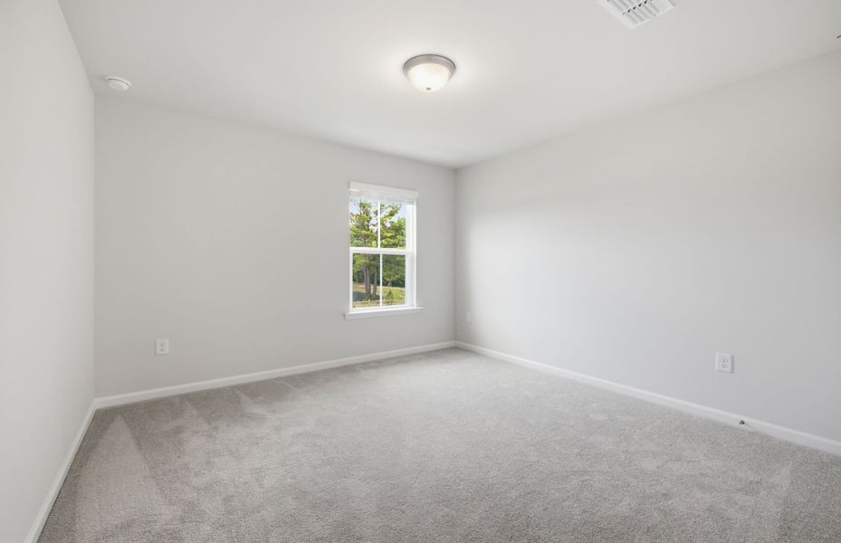 Spacious, unfurnished interior of a new home in Saunders Farm, Willow Spring (Image 24).