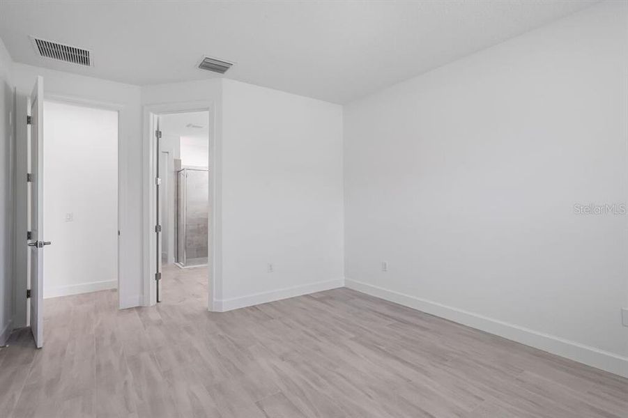 Spacious, unfurnished interior of a new home in Esplanade at Westview, Kissimmee (Image 23).