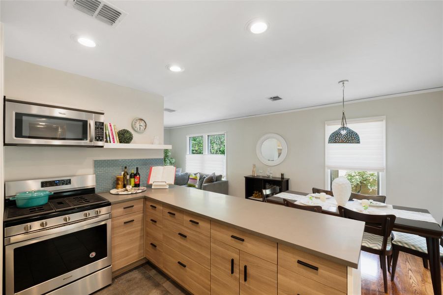 Streamlined kitchen design blends seamlessly into the open concept living and dining spaces. Streamlined kitchen design blends seamlessly into the open concept living and dining spaces.