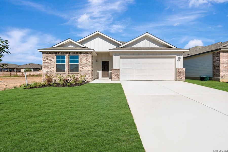 Front exterior of a new home in Vista Gardens, San Antonio, TX, highlighting curb appeal (Image 2). Front exterior of a new home in Vista Gardens, San Antonio, TX, highlighting curb appeal (Image 2).