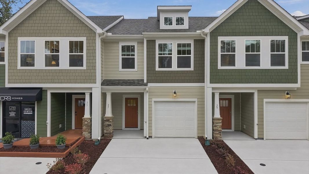 Front exterior of a new home in Brookland Place, Hendersonville, NC, highlighting curb appeal (Image 1). Front exterior of a new home in Brookland Place, Hendersonville, NC, highlighting curb appeal (Image 1).