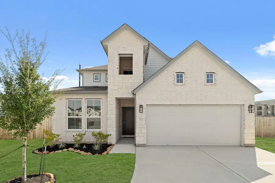 Front exterior of a new home in Morton Creek Ranch, Katy, TX, highlighting curb appeal (Image 1).