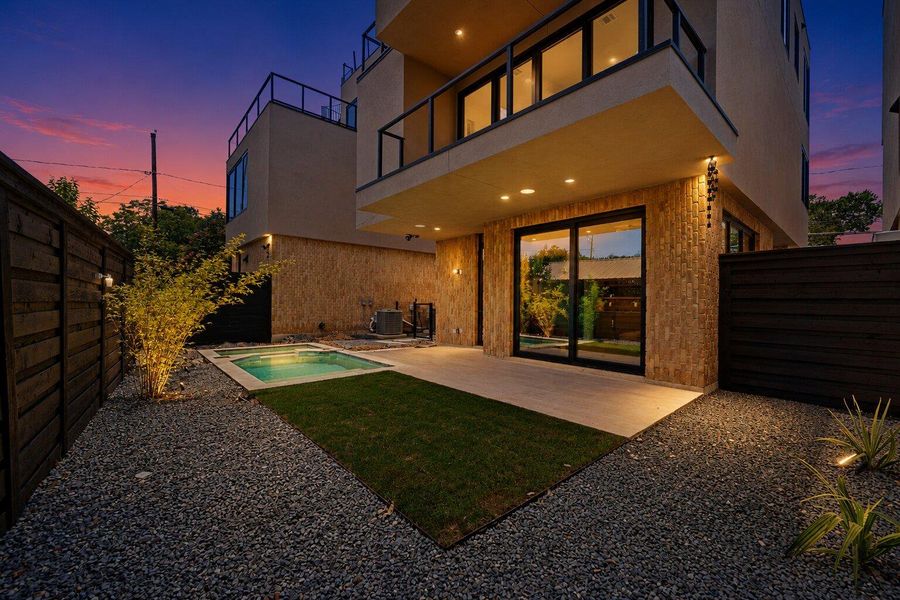 An inviting backyard oasis offers a sparkling spa, lush lawn, and private patio for tranquil evenings. An inviting backyard oasis offers a sparkling spa, lush lawn, and private patio for tranquil evenings.