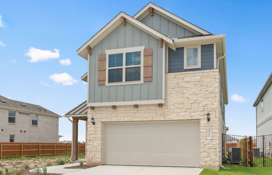Front exterior of a new home in Santa Rita Ranch, Liberty Hill, TX, highlighting curb appeal (Image 23).