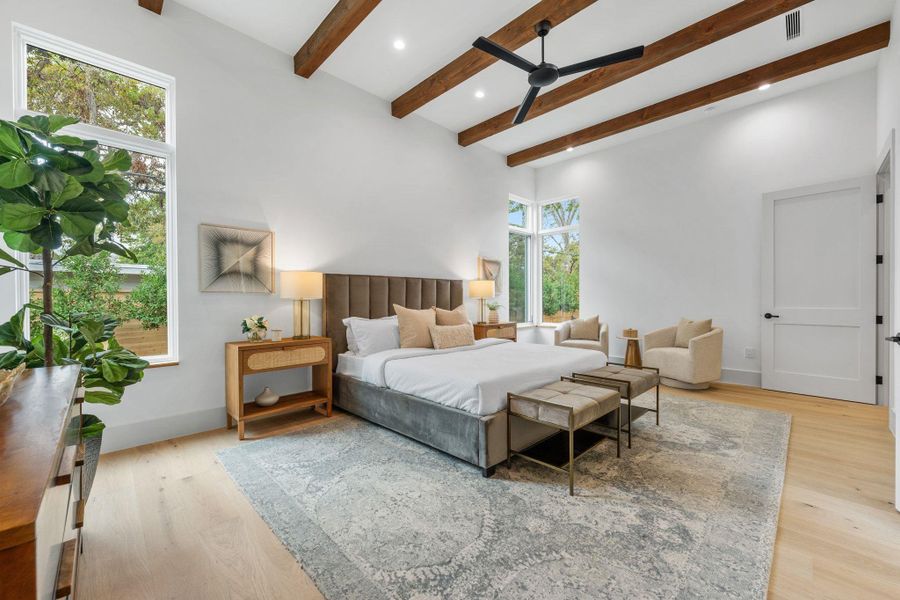 Bedroom featuring beam ceiling, light wood-style flooring, a ceiling fan, and recessed lighting Bedroom featuring beam ceiling, light wood-style flooring, a ceiling fan, and recessed lighting