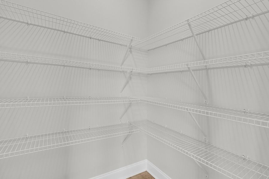 Spacious, unfurnished interior of a new home in Tidewater at Lakes of Cane Bay, Summerville (Image 34).