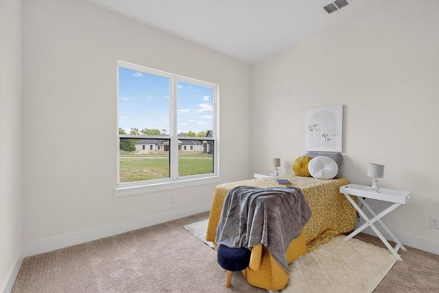 Bedroom with carpet flooring and baseboards Bedroom with carpet flooring and baseboards