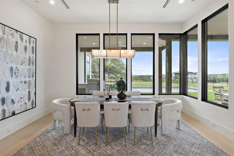 Dining space with visible vents, baseboards, wood finished floors, and recessed lighting Dining space with visible vents, baseboards, wood finished floors, and recessed lighting