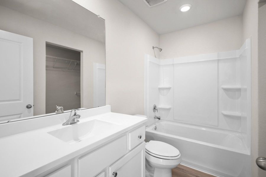 Primary Bathroom coms with a shower and tub combo Primary Bathroom coms with a shower and tub combo