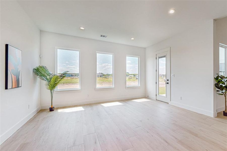 Spare room featuring light hardwood / wood-style floors