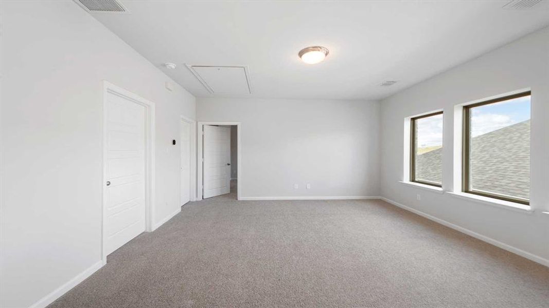 Spare room featuring light colored carpet