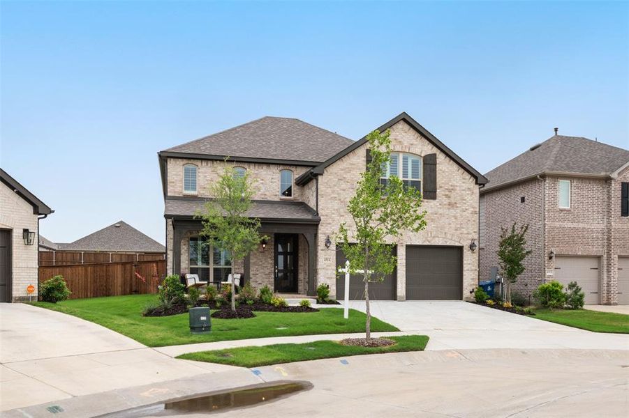 Front exterior of a new home in , Oak Point, TX, highlighting curb appeal (Image 1). Front exterior of a new home in , Oak Point, TX, highlighting curb appeal (Image 1).