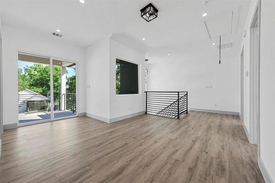 Unfurnished living room with light hardwood / wood-style flooring