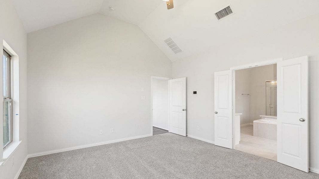 Furnished interior view inside a new home in Sunterra, Katy (Image 22).