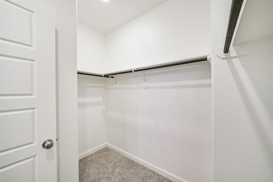 The primary closet has many storage solutions. The primary closet has many storage solutions.