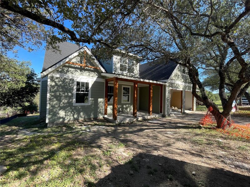 Inviting front exterior featuring fresh Hardi siding, natural wood columns, and a covered porch. Inviting front exterior featuring fresh Hardi siding, natural wood columns, and a covered porch.