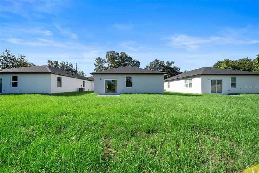 Front exterior of a new home in , Orlando, FL, highlighting curb appeal (Image 20).