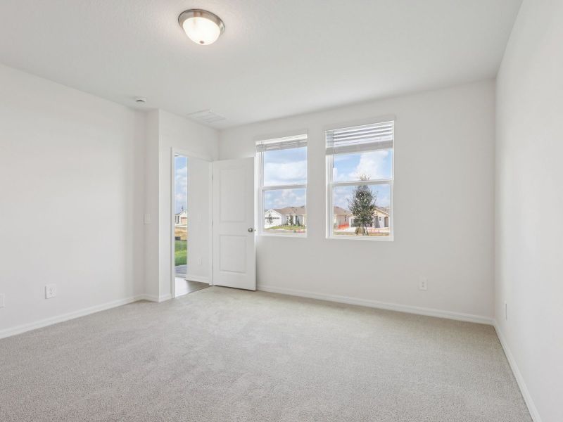 Spacious, unfurnished interior of a new home in The Reserve at Hammock Oaks - Classic Series, Lady Lake (Image 10).