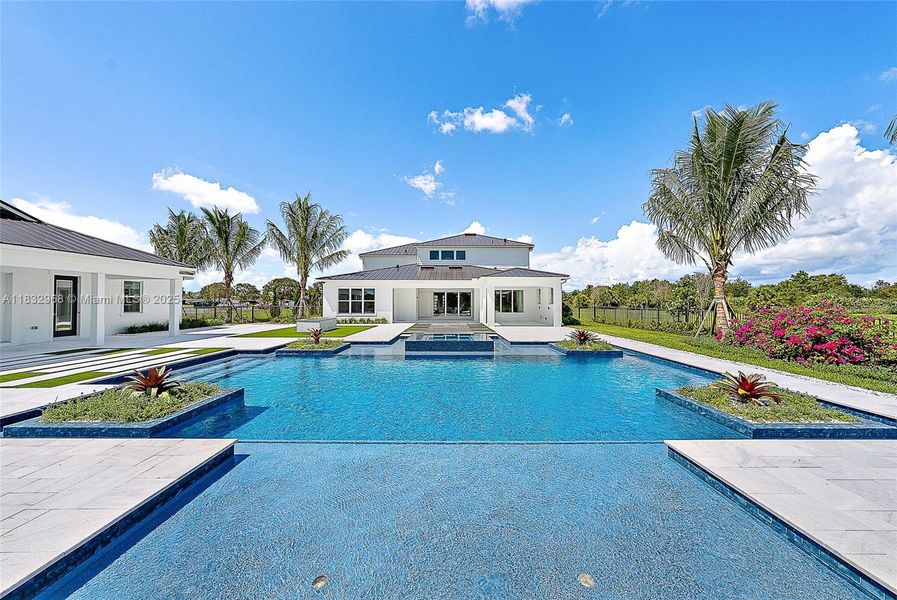 Front exterior of a new home in Bridgewater, Jupiter, FL, highlighting curb appeal (Image 25). Front exterior of a new home in Bridgewater, Jupiter, FL, highlighting curb appeal (Image 25).